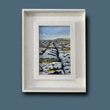 Load image into Gallery viewer, Framed painting of a landscape with a white frame on a blue background