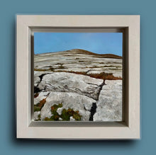 Load image into Gallery viewer, Framed artwork of a landscape with rocky terrain and blue sky.