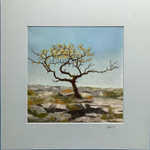 Load image into Gallery viewer, Painting of a lone tree on rocky terrain with a blue sky.