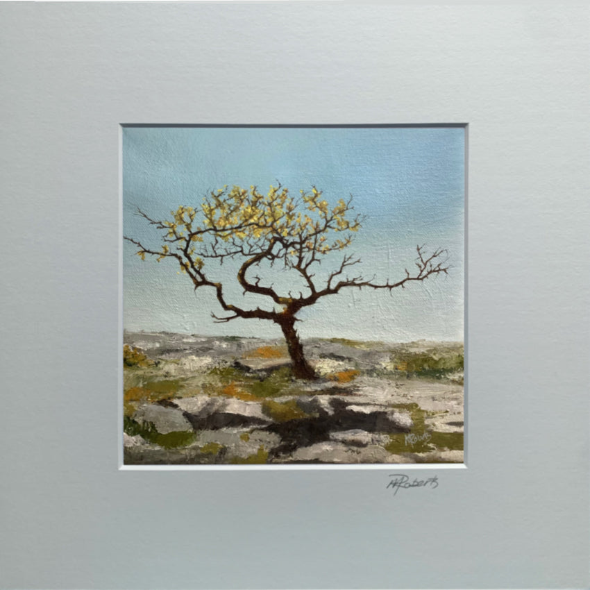Painting of a lone tree on rocky terrain with a blue sky.