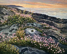 Load image into Gallery viewer, An oil painting of a rocky coastal landscape at sunset, featuring pink and yellow wildflowers blooming on dark gray rocks with a calm sea and warm orange sky in the background.