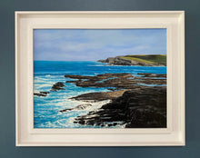 Load image into Gallery viewer, Framed artwork of a coastal scene with blue ocean and rocky cliffs.