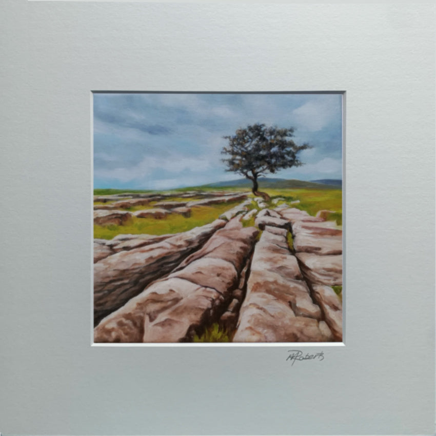 Painting of a lone tree on a rocky landscape with a blue sky.