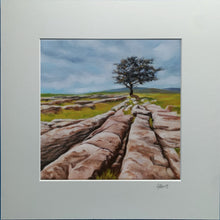 Load image into Gallery viewer, Painting of a lone tree on a rocky landscape with a cloudy sky.